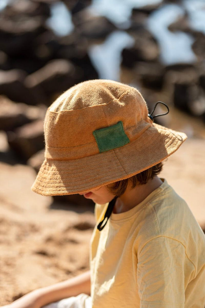 
                      
                        Terry Towelling Bucket Hat | Caramel
                      
                    