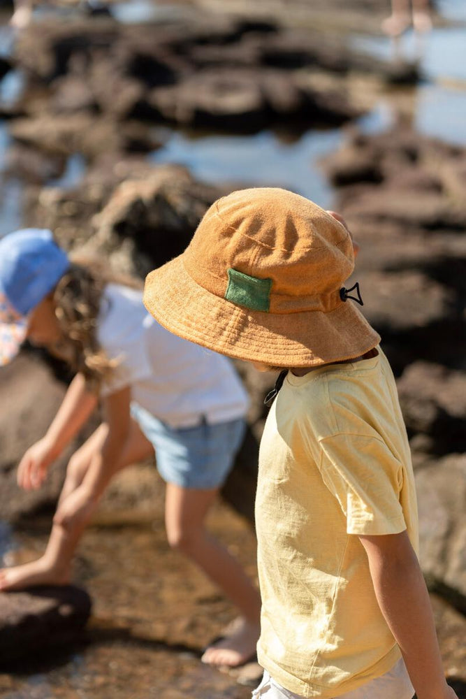 
                      
                        Terry Towelling Bucket Hat | Caramel
                      
                    