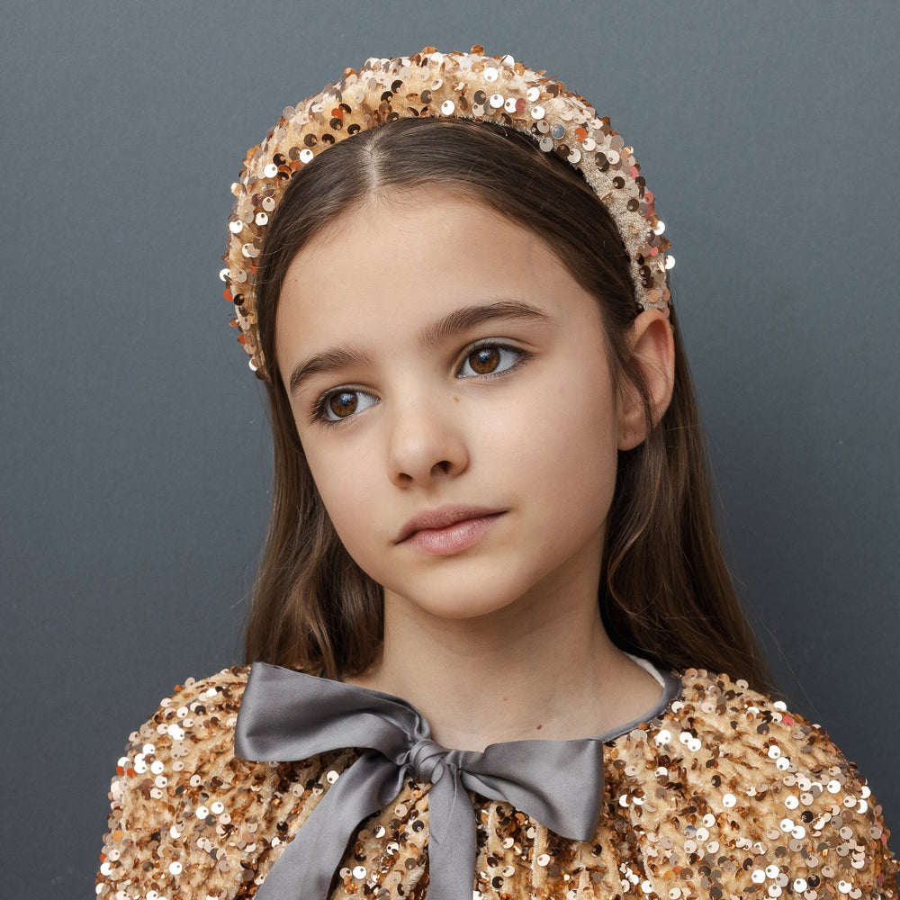 
                      
                        Sequin Cape
                      
                    