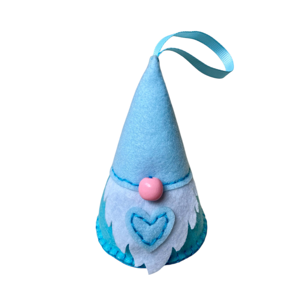 Blue gnome ornament with a pink nose and white beard on a white background