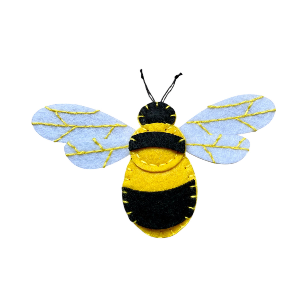Felt bee decoration with yellow body on a white background