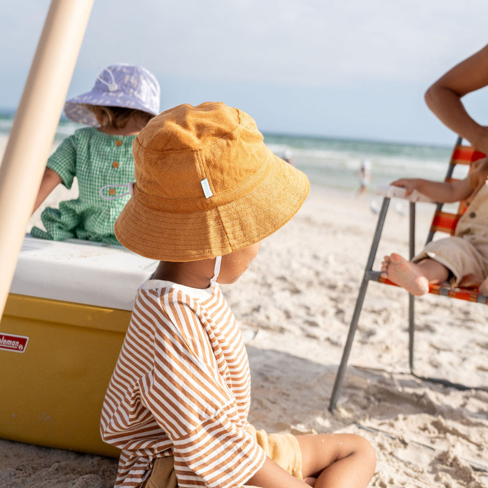 
                      
                        Terry Towelling Bucket Hat | Caramel
                      
                    