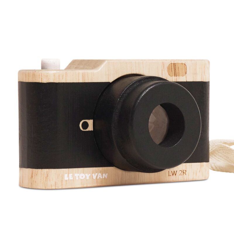 Vintage Wooden toy camera with black lens on a white background.