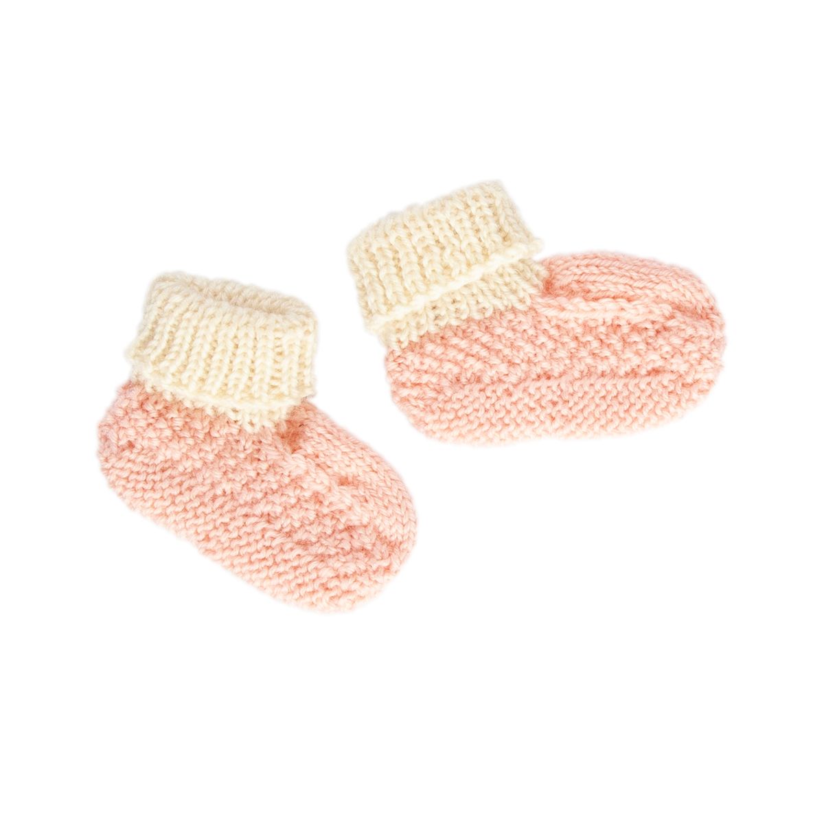Pair of pink and beige knitted baby booties on a white background